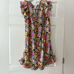 New without tags floral umgee brand romper with a key hole closer in the back